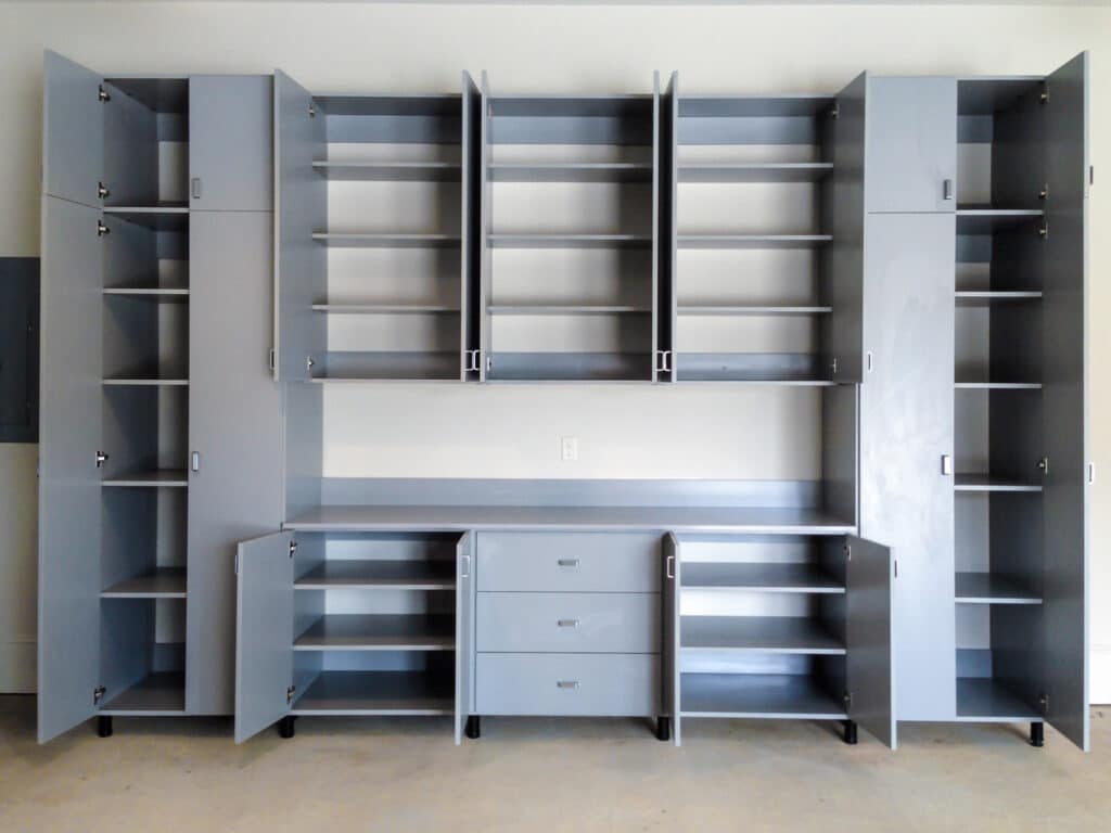 Grey garage storage system with shelving and drawers