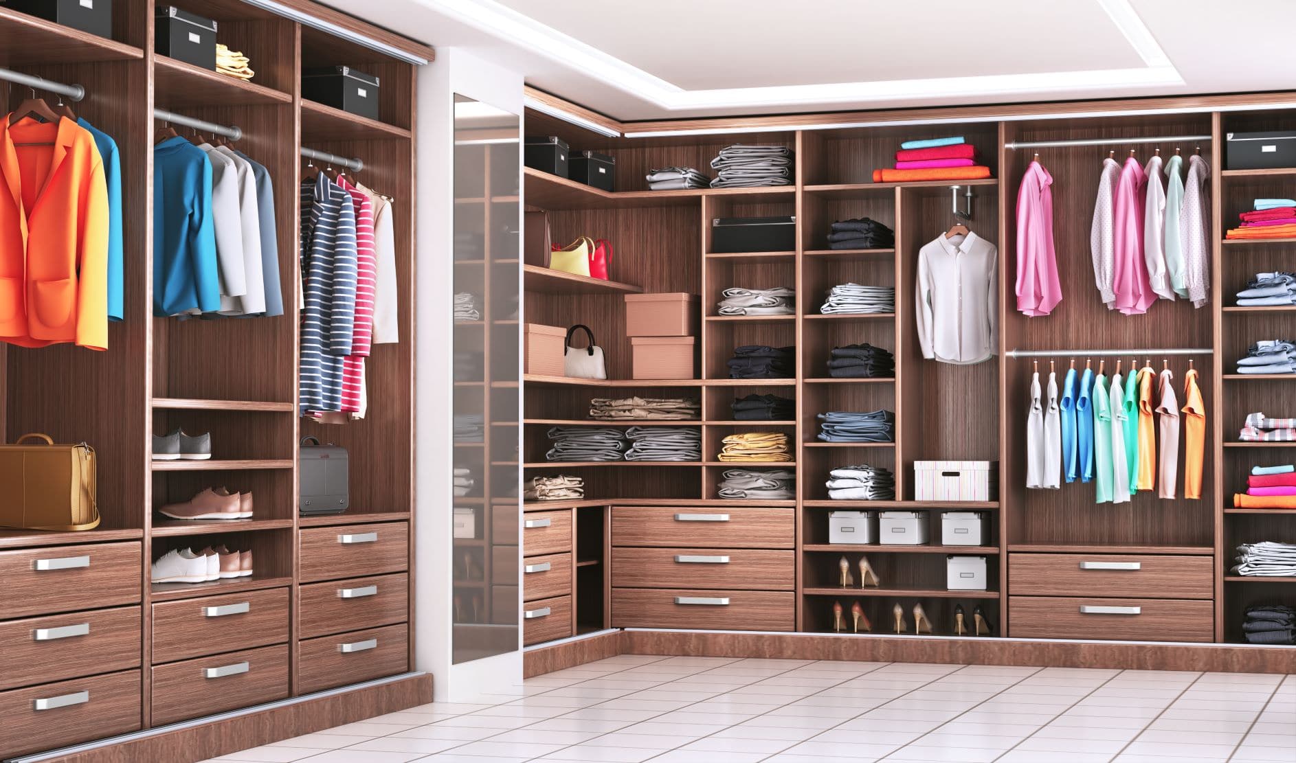 Large walk-in closet with wood shelving and drawers 