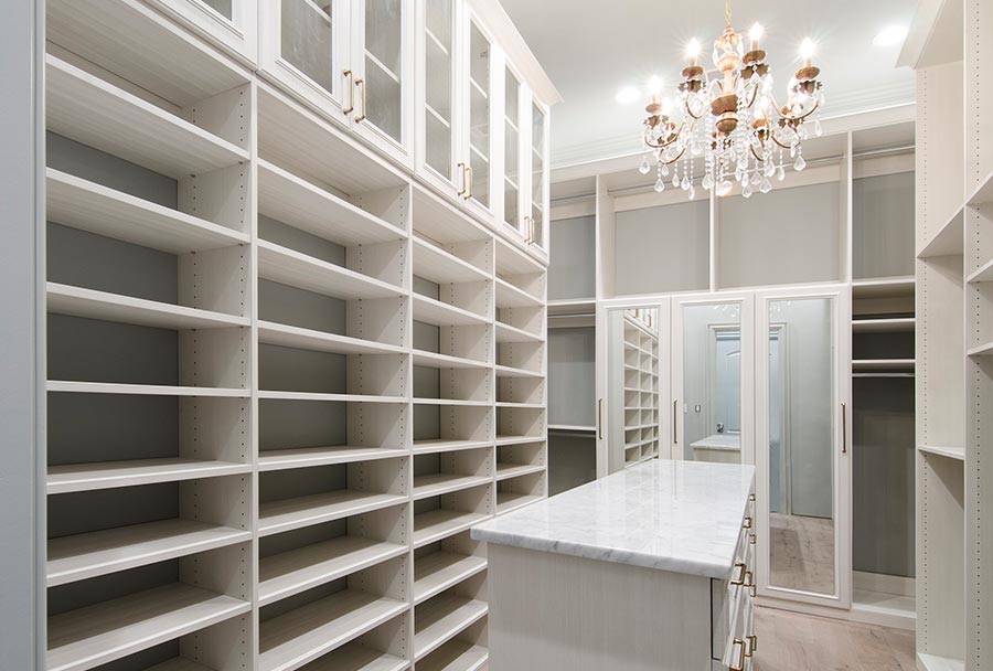 white closet with chandelier