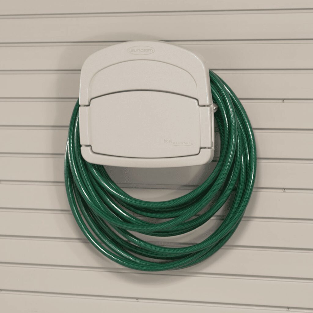 green garden hose on Wall Mount Hose Holder