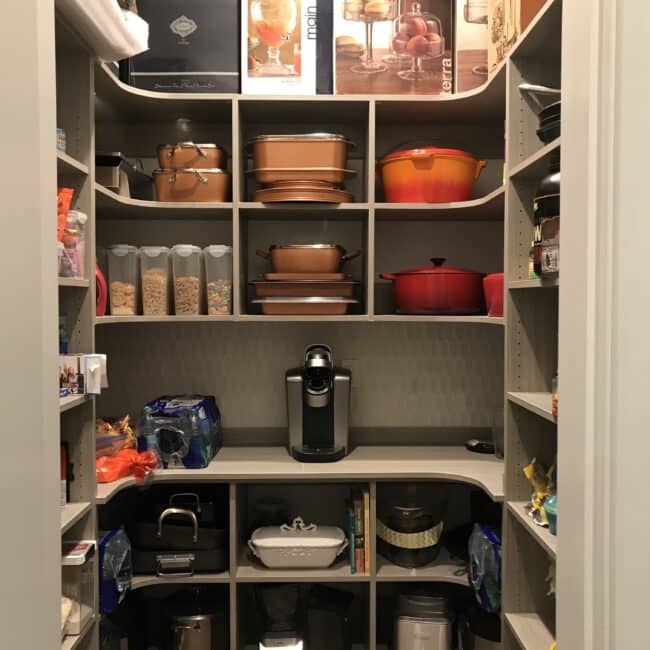 custom built pantry with food and storage items