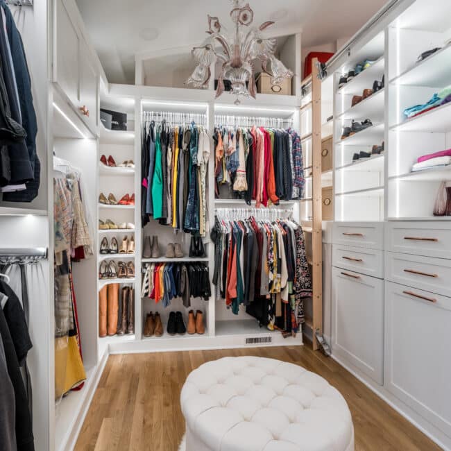 sitting area and clothes storage in a custom closet built by ruffino custom closets