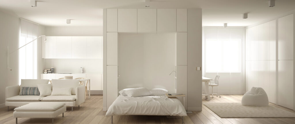 murphy bed pulled out in modern white apartment