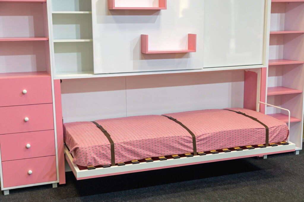 pink murphy bed pulled out in kids bedroom